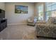 Comfortable living room featuring plush armchairs, natural light, and contemporary decor at 1001 Parker Ln, Westfield, IN 46074