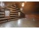 Bright attic bedroom with wood walls and floors, two windows, and wood ceiling at 1084 Chipmunk Ln, Pendleton, IN 46064
