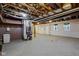Unfinished basement with exposed beams, concrete floor, and mechanicals at 1084 Chipmunk Ln, Pendleton, IN 46064