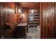 Rustic bathroom with log walls and marble floor at 1084 Chipmunk Ln, Pendleton, IN 46064