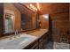 Bathroom with wooden vanity and marble shower at 1084 Chipmunk Ln, Pendleton, IN 46064