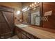 Bathroom with wooden vanity and large mirror at 1084 Chipmunk Ln, Pendleton, IN 46064
