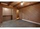 Simple bedroom with wood walls and floors at 1084 Chipmunk Ln, Pendleton, IN 46064