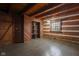 Simple bedroom with wood walls and floors at 1084 Chipmunk Ln, Pendleton, IN 46064