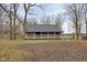 Log cabin home exterior with a spacious yard at 1084 Chipmunk Ln, Pendleton, IN 46064