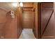 Long hallway with wood walls and tile floor at 1084 Chipmunk Ln, Pendleton, IN 46064
