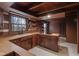 Rustic kitchen with wooden cabinets, wood countertops, and a window with a view at 1084 Chipmunk Ln, Pendleton, IN 46064