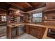 Rustic kitchen with wooden cabinets, wood countertops, and a window with a view at 1084 Chipmunk Ln, Pendleton, IN 46064