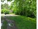 An image of home's backyard space, revealing its lush green landscape and peaceful, private setting at 1128 N Holmes Ave, Indianapolis, IN 46222