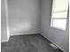 Empty bedroom with gray walls and gray carpeting at 1128 N Holmes Ave, Indianapolis, IN 46222