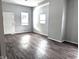 Living room featuring gray walls and dark wood flooring at 1128 N Holmes Ave, Indianapolis, IN 46222