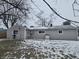 Grey vinyl sided home with a small snow covered backyard at 117 Tracy Rd, Whiteland, IN 46184