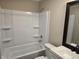 Updated bathroom with white vanity and bathtub at 117 Tracy Rd, Whiteland, IN 46184