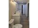 Main bathroom with white vanity, toilet and laundry area at 117 Tracy Rd, Whiteland, IN 46184