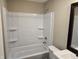 Clean bathroom with a tub, shower, and updated vanity at 117 Tracy Rd, Whiteland, IN 46184