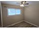 Bedroom with ceiling fan and two windows at 117 Tracy Rd, Whiteland, IN 46184