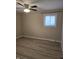 Bedroom with ceiling fan, window, and closet at 117 Tracy Rd, Whiteland, IN 46184