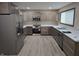 Modern kitchen with stainless steel appliances and light wood cabinets at 117 Tracy Rd, Whiteland, IN 46184