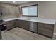 Modern kitchen featuring stainless steel appliances and gray cabinets at 117 Tracy Rd, Whiteland, IN 46184