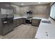 Renovated kitchen, featuring stainless steel appliances and gray cabinets at 117 Tracy Rd, Whiteland, IN 46184