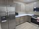 Updated kitchen with stainless steel appliances and light wood cabinets at 117 Tracy Rd, Whiteland, IN 46184