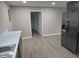 Modern kitchen with stainless steel refrigerator and gray cabinets at 117 Tracy Rd, Whiteland, IN 46184