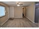 Living room with laminate floors, front door access, and ceiling fan at 117 Tracy Rd, Whiteland, IN 46184