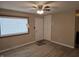 Living room with laminate floors, front door access, and ceiling fan at 117 Tracy Rd, Whiteland, IN 46184