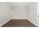 Simple bedroom with light gray walls and wood floors at 1218 N Grant Ave, Indianapolis, IN 46201