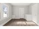Spacious bedroom with dark wood floors and a view at 1218 N Grant Ave, Indianapolis, IN 46201