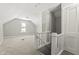 Bright bonus room featuring carpet and stairway access at 1218 N Grant Ave, Indianapolis, IN 46201