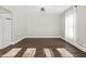 Bright dining room with dark wood floors and a light gray wall at 1218 N Grant Ave, Indianapolis, IN 46201