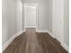Hallway with wood-look floors and neutral walls at 1218 N Grant Ave, Indianapolis, IN 46201