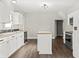 Modern kitchen with white cabinets and butcher block island at 1218 N Grant Ave, Indianapolis, IN 46201