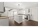 Open concept kitchen with white cabinets and kitchen island at 1218 N Grant Ave, Indianapolis, IN 46201