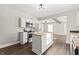 Open concept kitchen with island and stainless steel appliances at 1218 N Grant Ave, Indianapolis, IN 46201
