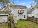 Backyard with a shed and a grill, next to house at 128 Wisconsin St, Indianapolis, IN 46225