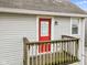 Private balcony with red door and wooden railing at 128 Wisconsin St, Indianapolis, IN 46225