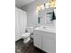 Clean bathroom with white vanity and dark tile floor at 128 Wisconsin St, Indianapolis, IN 46225