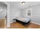 Bright bedroom with a double bed and hardwood floors at 128 Wisconsin St, Indianapolis, IN 46225