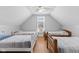 Large bedroom with four twin beds and a window at 128 Wisconsin St, Indianapolis, IN 46225