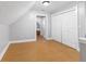 Upstairs bedroom with hardwood floors and access to other rooms at 128 Wisconsin St, Indianapolis, IN 46225