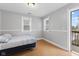 Bedroom with a double bed and access to a deck at 128 Wisconsin St, Indianapolis, IN 46225
