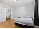 Bright bedroom with wood floors and access to another room at 128 Wisconsin St, Indianapolis, IN 46225