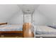Shared bedroom with two twin beds and wood floors at 128 Wisconsin St, Indianapolis, IN 46225