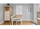 Small dining area with a wooden table and white chairs at 128 Wisconsin St, Indianapolis, IN 46225