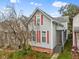 Gray siding house with orange shutters and a small front yard at 128 Wisconsin St, Indianapolis, IN 46225