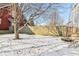 Snowy backyard with wooden fence and tree at 1418 S New Jersey St, Indianapolis, IN 46225