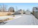 Snowy backyard with a fire pit and shed at 1418 S New Jersey St, Indianapolis, IN 46225