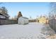 Snowy backyard with shed and wooden fence at 1418 S New Jersey St, Indianapolis, IN 46225